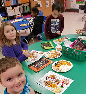 Students playing with food