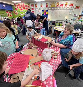 Young students working on a fun chef/cooking activity
